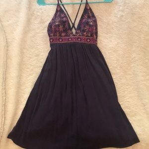 A short summer dress with a criss cross back